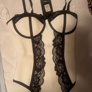 Fashion Nova White With Black trimming and lace bodysuit.